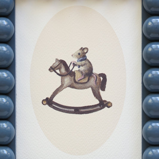 Mouse on rocking horse in Bobbin frame A6