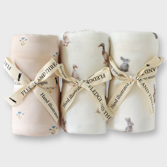 Muslin vs Stretch Swaddles: How to Choose for Your Newborn