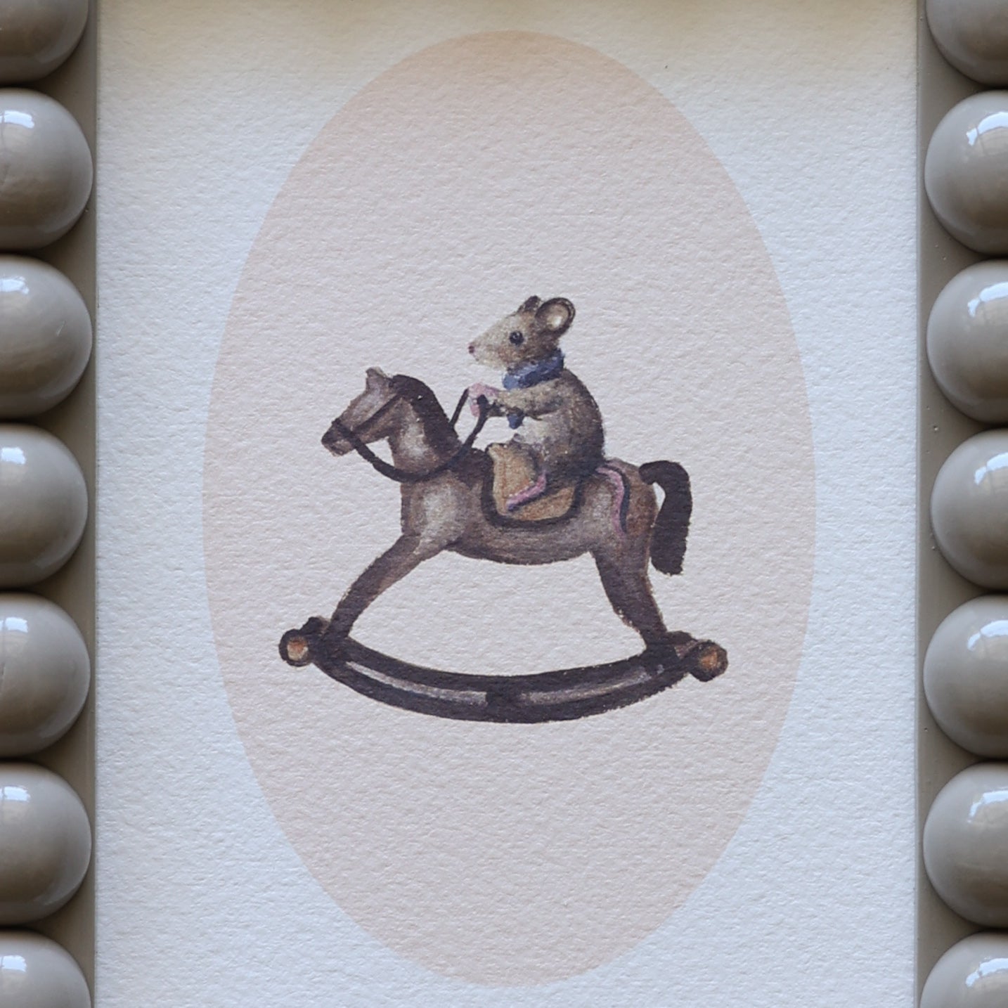 Mouse on rocking horse in Bobbin frame A6