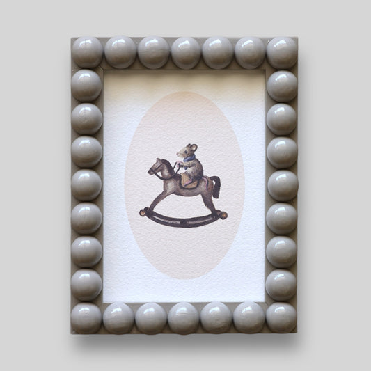 Mouse on rocking horse in Bobbin frame A6