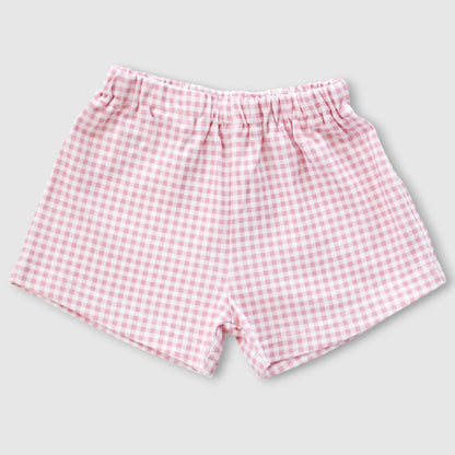 Pink and white gingham checkered baby shorts with an elastic waistband, shown flat on a light gray background.